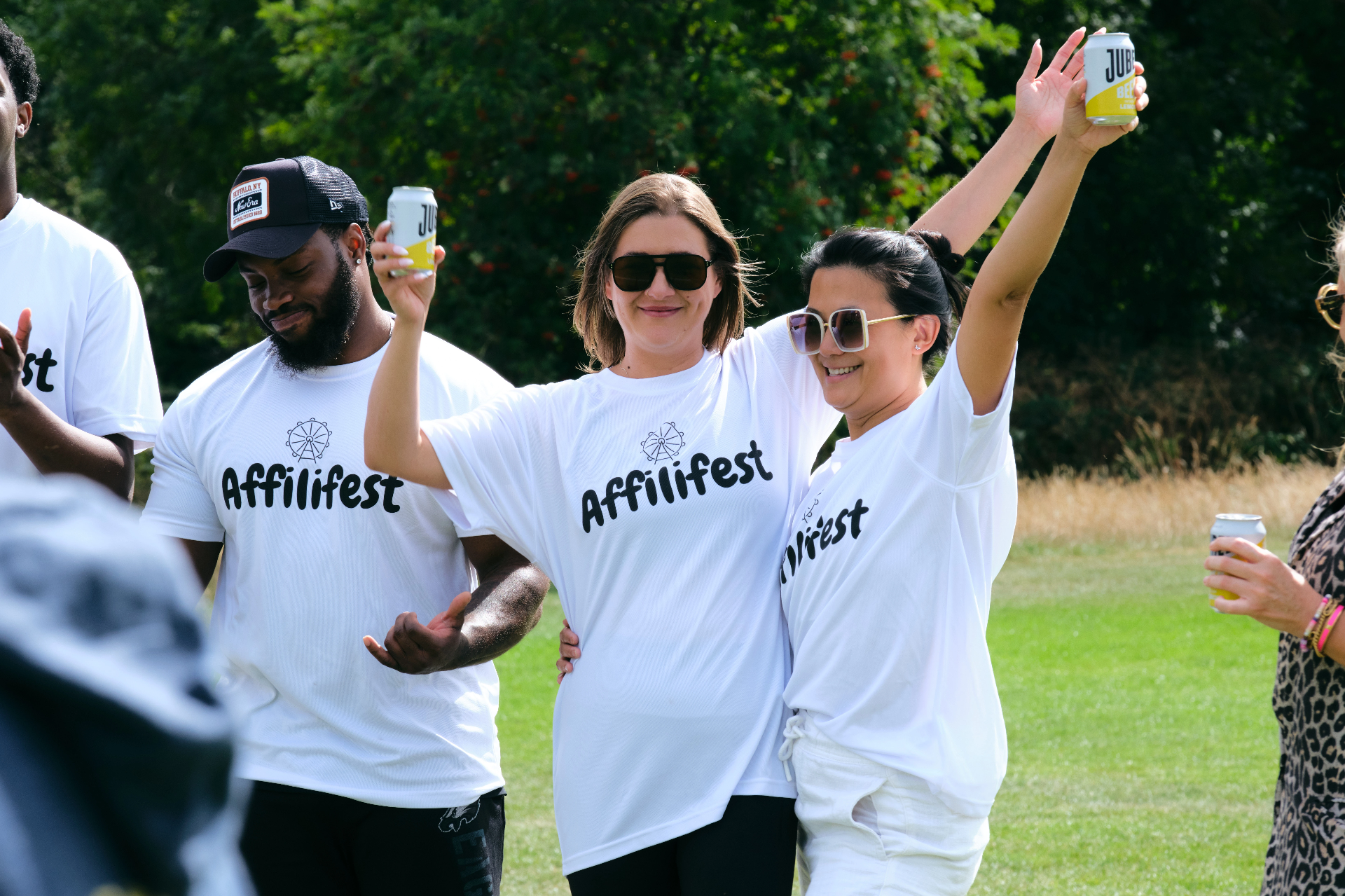 White team cheering with drinks in hand